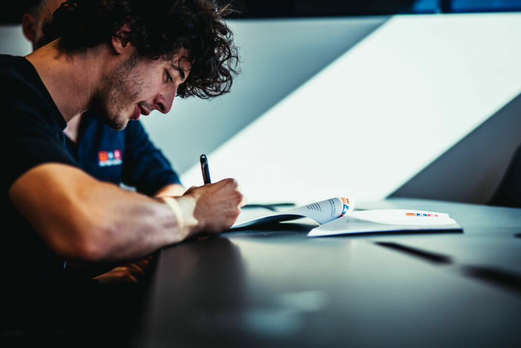 Celestino Vietti signing his new contract with KTM. Photo courtesy KTM Factory Racing.