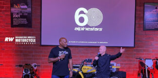 Comedian and actor Alonzo Bodden (left) and MotoGP Legend Randy Mamola (right) were the masters of ceremonies for the Alpinestars 60th anniversary celebration in downtown Los Angeles. Note the poster in the upper left corner, which commemorates the beginning of the company's work on inflatable rider protection. Airbags now are required protective gear at the international racing level. Photo by Michael Gougis.