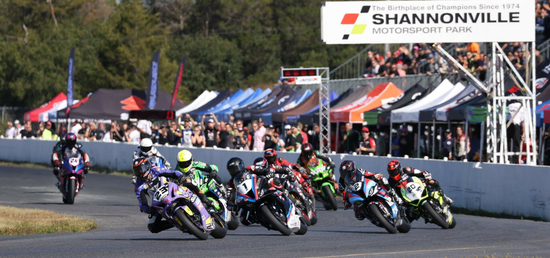 It was Alex Dumas (23) who grabbed the holeshot and led most of Saturday's Superbike race two at Shannonville Motorsport Park. Ben Young (1) took the lead on the last lap and went on to win the race, clinching the 2023 CSBK championship in the process. Trevor Dion (20) was third. Photo by Rob O'Brien, courtesy CSBK.