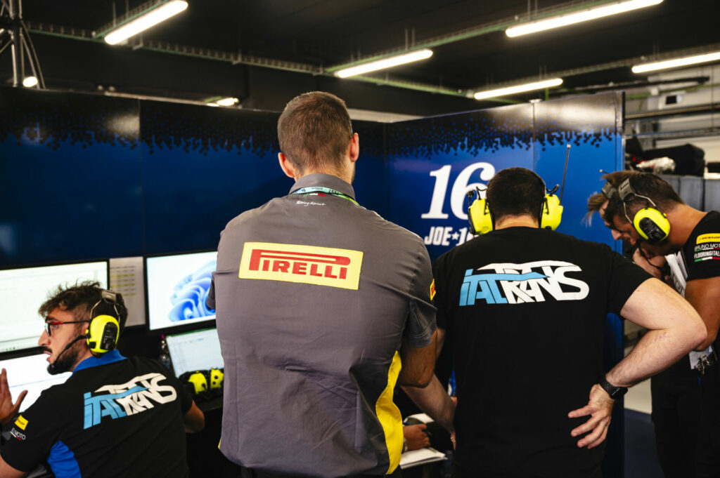 A Pirelli technician listening to Joe Roberts at Catalunya. Photo courtesy Pirelli.