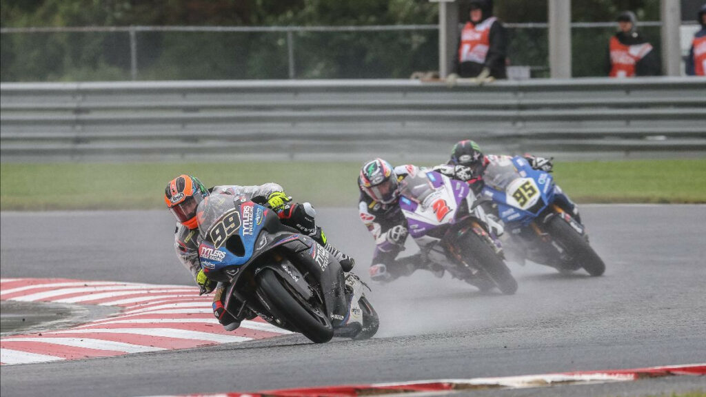PJ Jacobsen (99) finished second on track, but was penalized two spots for passing under a waving yellow flag. JD Beach (95) ended up second with Josh Herrin (2) finishing fifth. Photo by Brian J. Nelson.