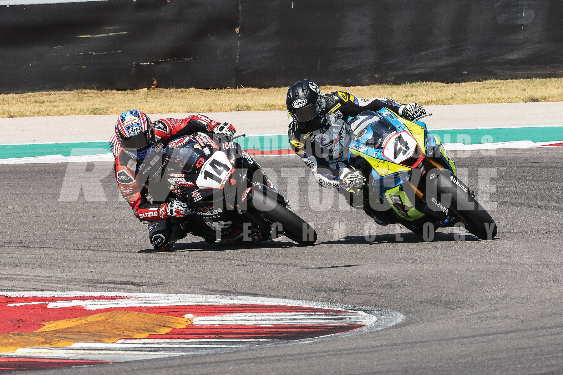 Torin Collins (14) dives past 4-Time AMA Superbike Champion (and race-wins record holder) Josh Hayes (4) on his way to a podium finish in Race Two. Photo by Brian J. Nelson.