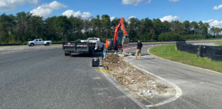Workers pulling up the inside curbing in Turn One of New Jersey Motorsports Park's Thunderbolt Raceway. Photo courtesy NJMP.