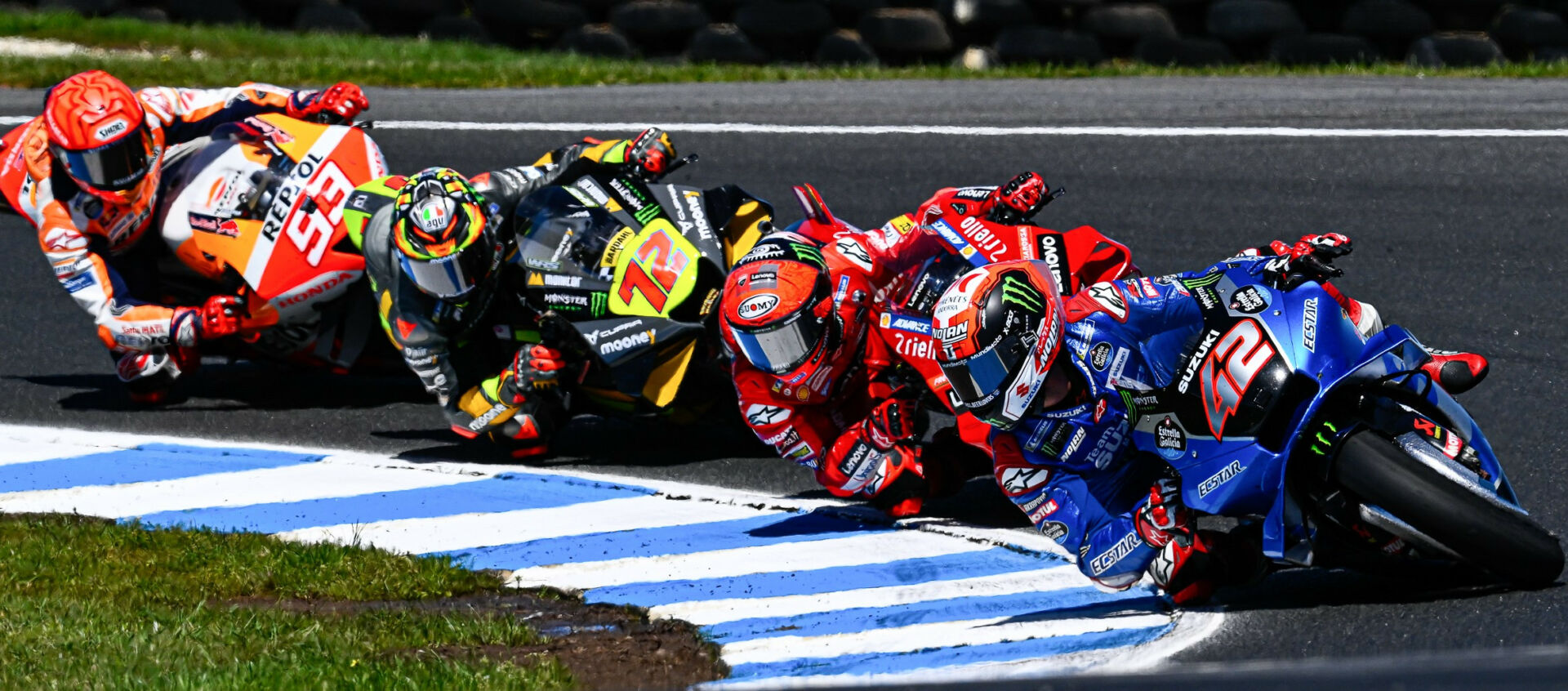 Alex Rins (42) leading Francesco Bagnaia, Marco Bezzecchi (72), and Marc Marquez (93) during the MotoGP race at Phillip Island in 2022. Photo courtesy Dorna.