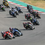 Josh Herrin (2) leads Jake Gagne (1), Richie Escalante (54), PJ Jacobsen (99), Brandon Paasch (96), Mathew Scholtz (11), and the rest of the field in MotoAmerica Superbike Race Two at Circuit of The Americas. Photo by Brian J. Nelson.