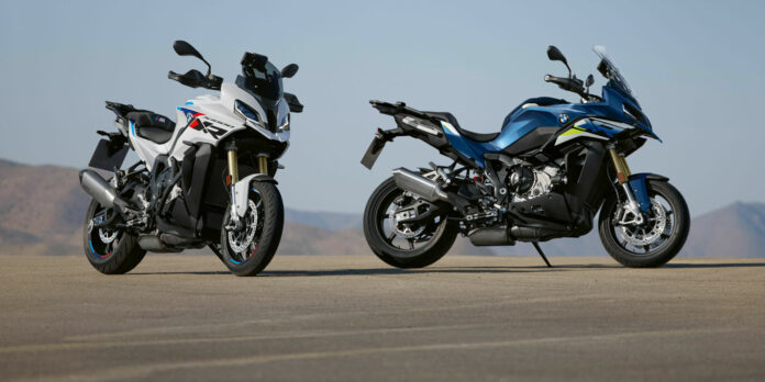 A 2024 BMW S 1000 XR in Gravity Blue Metallic (right) and a 2024 BMW S 1000 XR in Light White/M Motorsport (left) fitted with M Package equipment like the Sport Muffler and M Carbon Wheels. Photo courtesy BMW Motorrad.