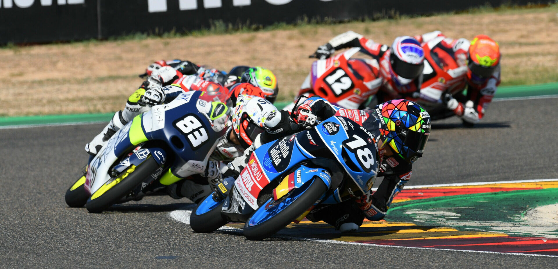 Angel Piqueras (18) leads Alvaro Carpe (83) in the FIM JuniorGP World Championship race at MotorLand Aragon. Photo courtesy Dorna.