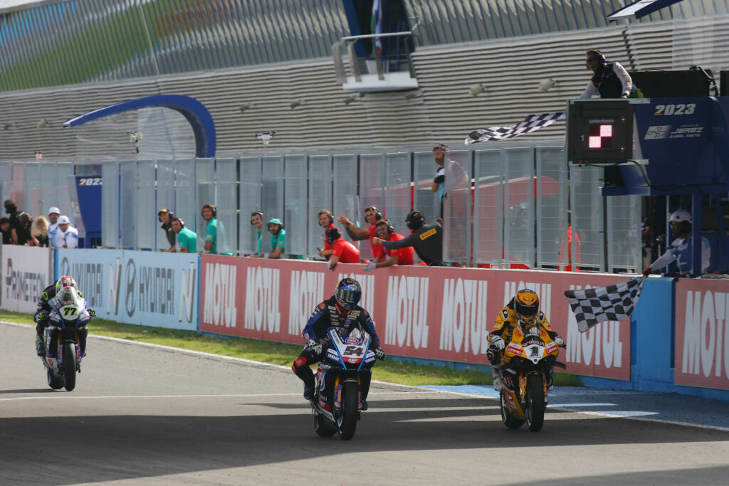 Toprak Razgatlioglu (54) and Alvaro Bautista (1) crossed the finish line practically side-by-side with Dominique Aegerter (77) close behind in third at the end of Race Two. Photo courtesy Dorna.