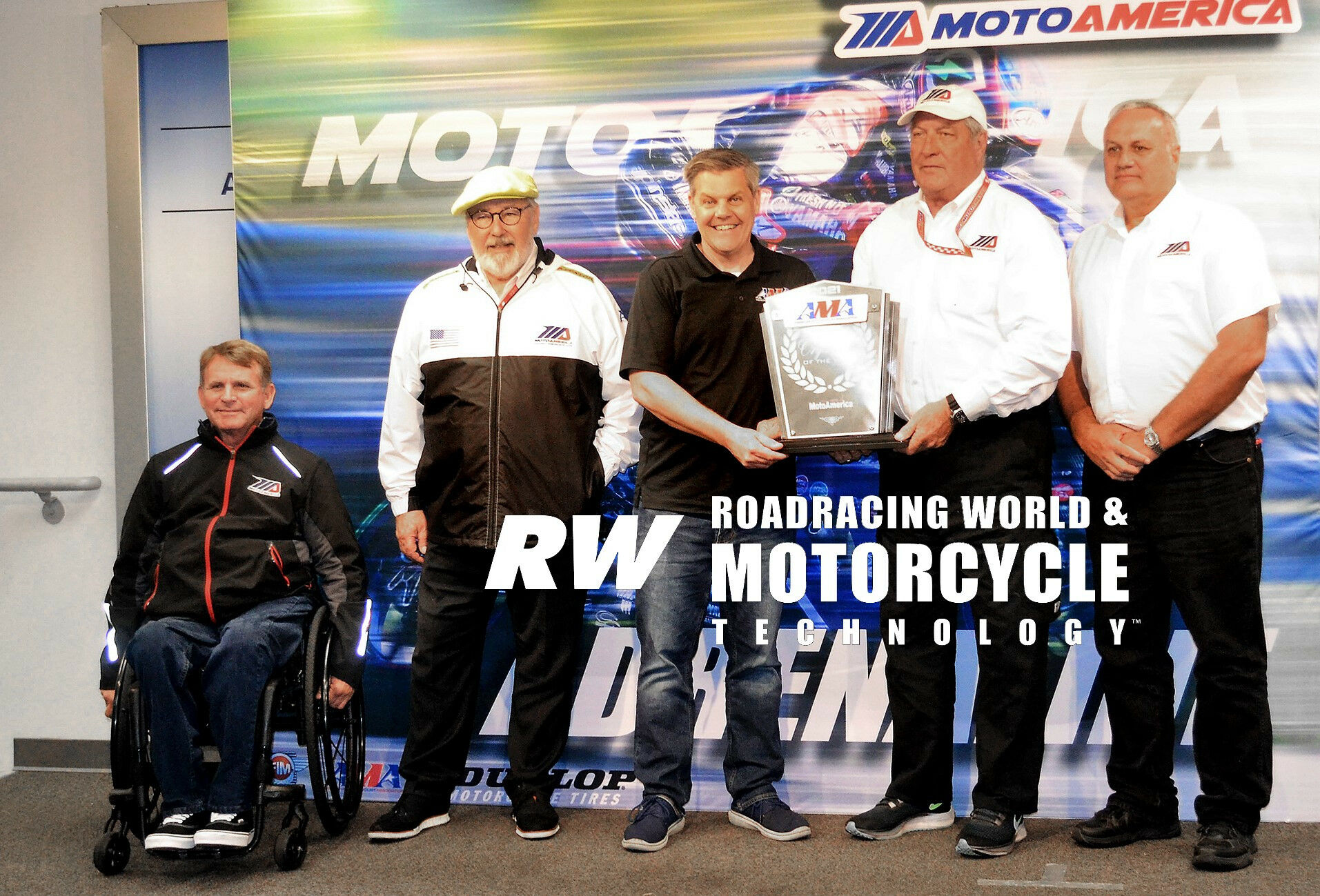 AMA President and CEO Rob Dingman (center) presented MotoAmerica with the 2021 Track Racing Organizer of the Year Award at Daytona in 2022. Accepting the award are (from left) MotoAmerica partners Wayne Rainey, Terry Karges, Richard Varner, and Chuck Aksland. Photo by David Swarts.