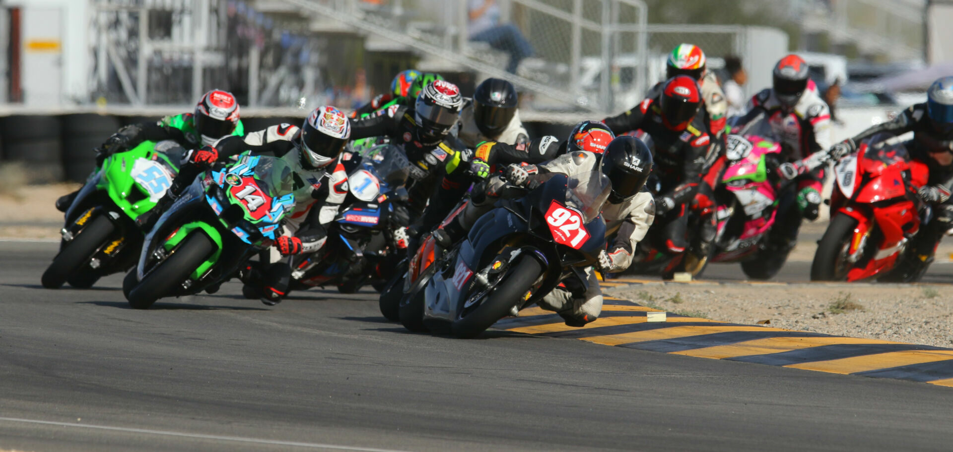 Dominik Gajda (921) leads Andrew Lee (14), Corey Alexander (1), Michael Gilbert (55), and the rest at the start of the CVMA 1000 Shootout race at Chuckwalla Valley Raceway. Photo by CaliPhotography.com, courtesy CVMA.