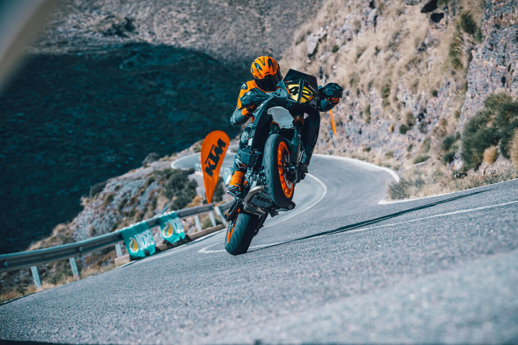 A 2024 KTM 890 SMT at speed on a closed course. Photo courtesy KTM.