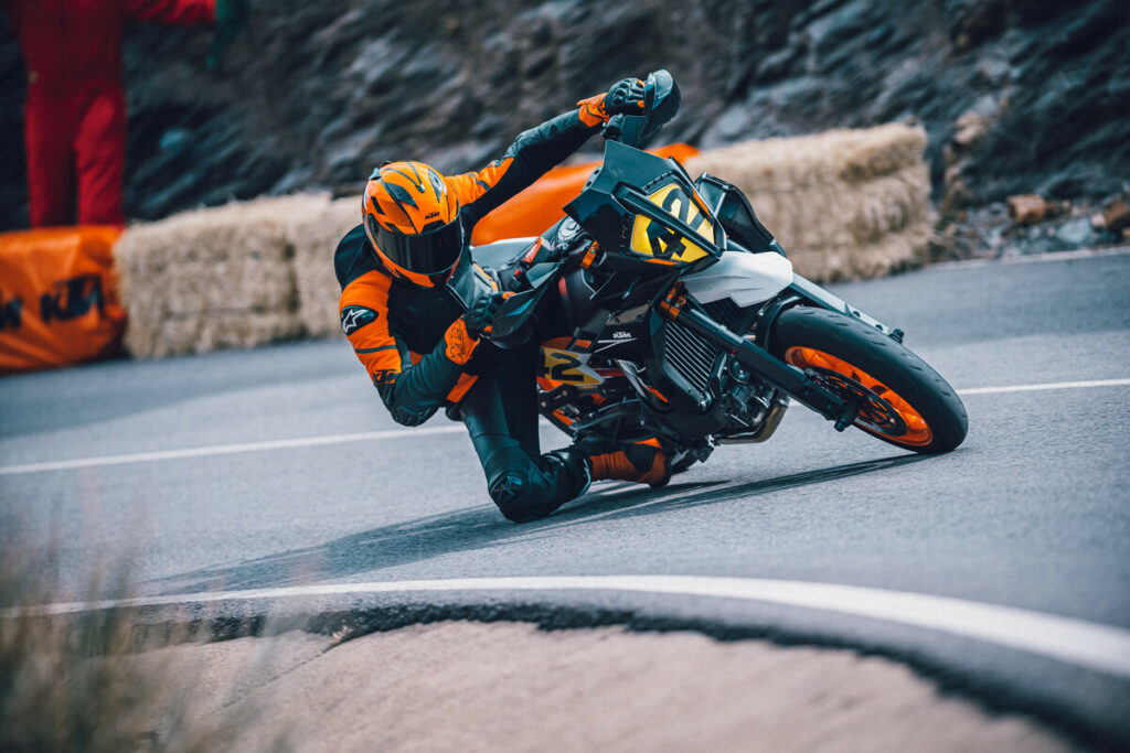 A 2024 KTM 890 SMT at speed on a closed course. Photo courtesy KTM.
