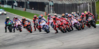 Pole-sitter Francesco Bagnaia (1) led the charge into Turn One at the start of the MotoGP Sprint race at Sepang. Photo by Kohei Hirota.