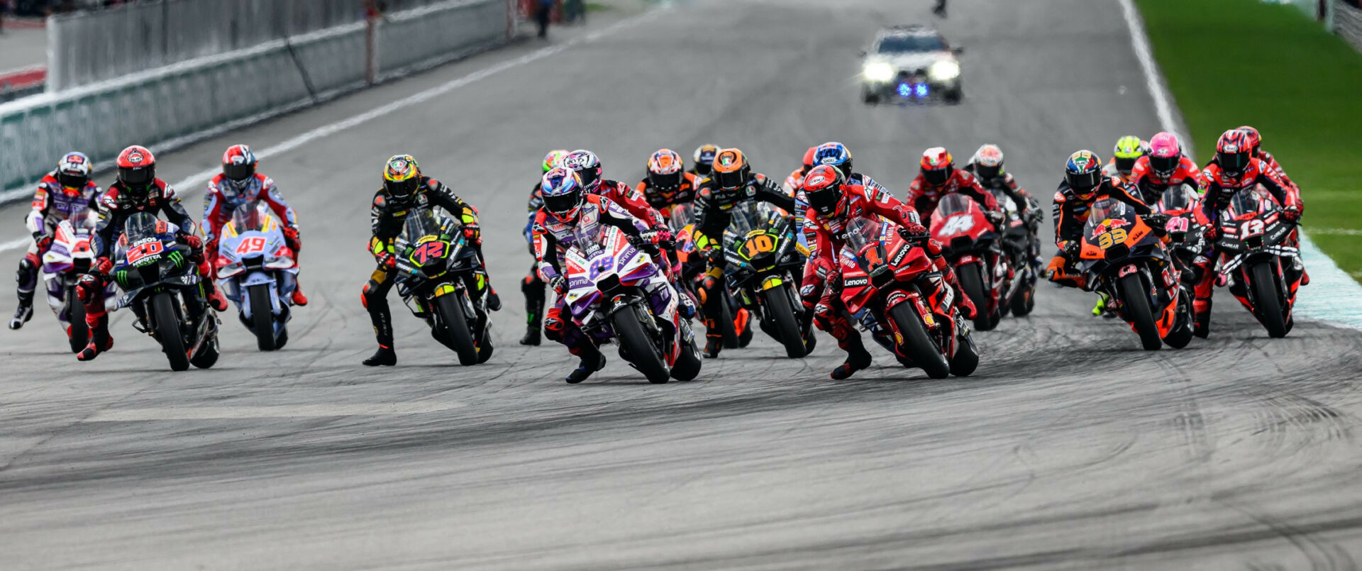 The start of Sunday's MotoGP race at Sepang with Francesco Bagnaia (1) and Jorge Martin (89) fighting for first place heading into Turn One. Photo by Kohei Hirota.