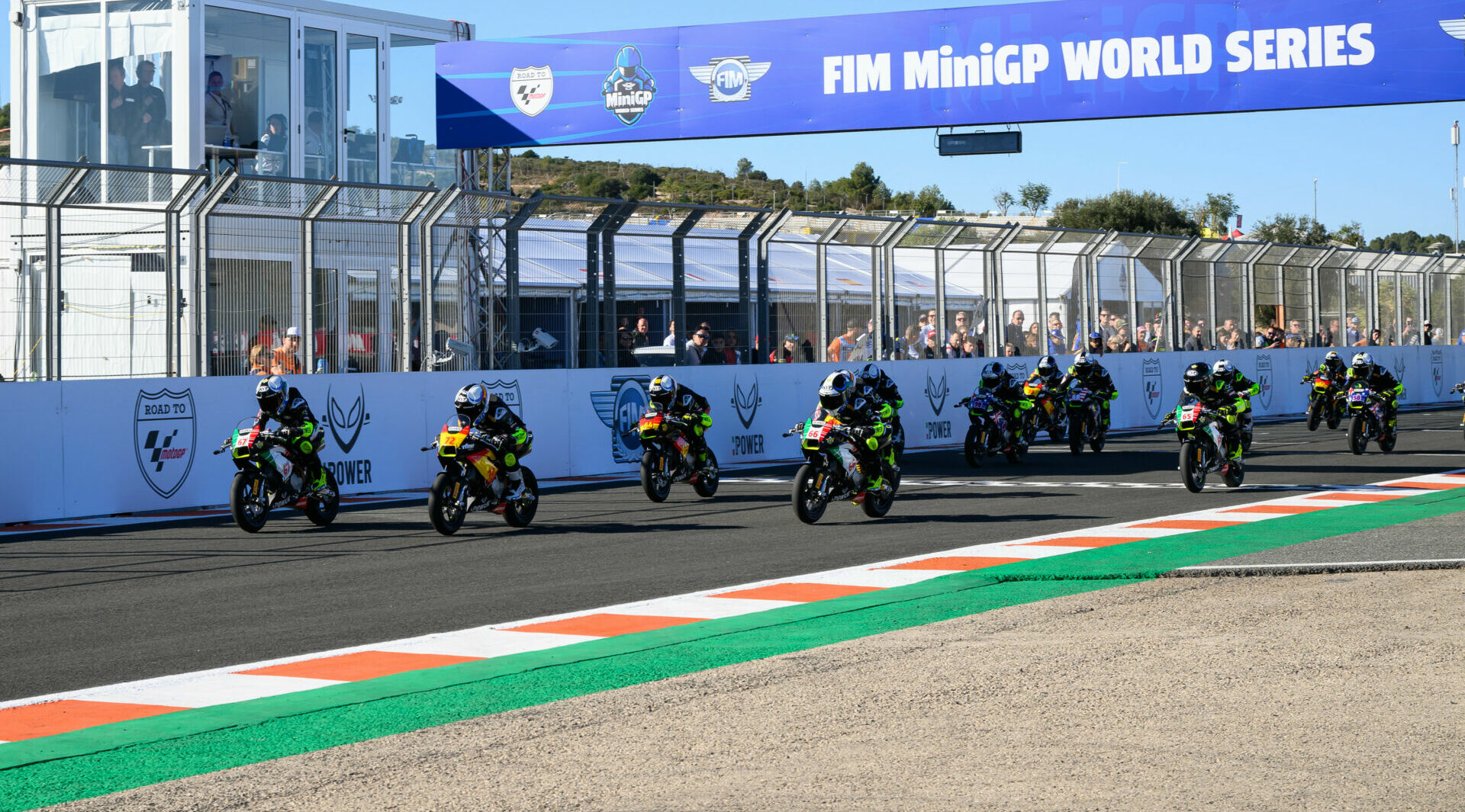 The start of FIM MiniGP World Series 190cc Race One with Lorenzo Pritelli (67) leading the field. Photo by Kohei Hirota.