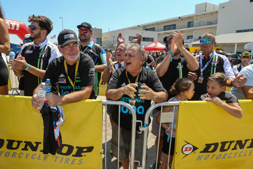 Tytlers Cycle Racing Team Owner Michael Kiley (front left), Stefano Mesa's father Mauricio Mesa (front center), and Stefano Mesa's mother Karen (behind Mauricio) at the podium at Circuit of The Americas (COTA). Photo courtesy Energica.