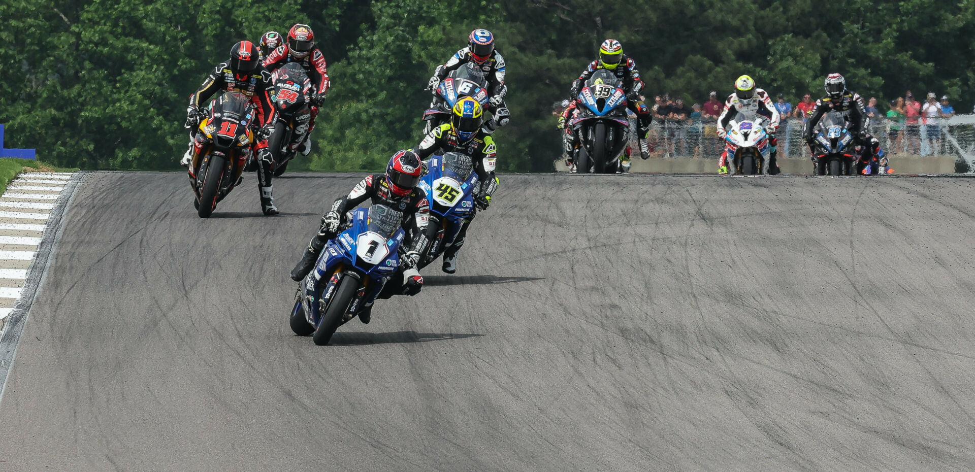 Jake Gagne (1) leads Cameron Petersen (45), Mathew Scholtz (11), Richie Escalante (54), Cameron Beaubier (6), PJ Jacobsen (99), and the rest of the MotoAmerica Superbike field at the start of Race Two at Barber Motorsports Park. Photo by Brian J. Nelson.