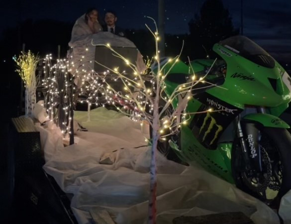 Roger and Elizabeth Hayden riding on a custom float (utilizing Hayden's Championship-winning Kawasaki) to their reception. Photo courtesy Roger Hayden.