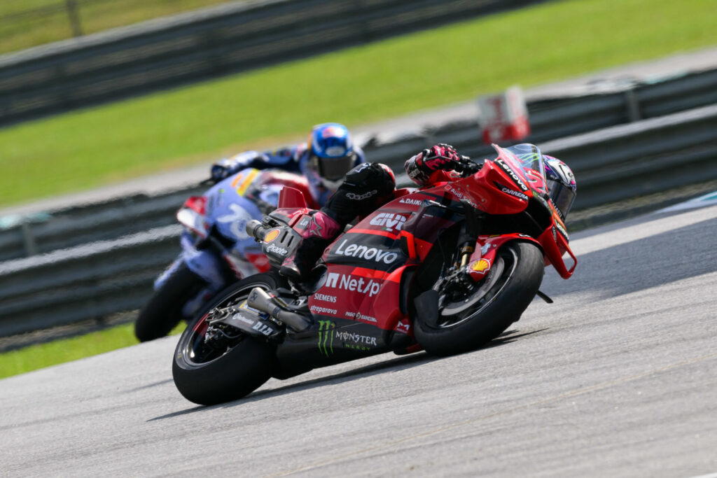 Enea Bastianini (23) held off Alex Marquez (73) to win the MotoGP race at Sepang. Photo by Kohei Hirota.