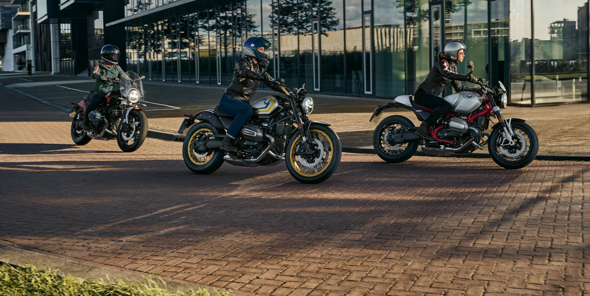 A 2024 BMW R 12 nineT roadster (right) followed by a pair of 2024 BMW R 12 cruisers. Photo courtesy BMW Motorrad.