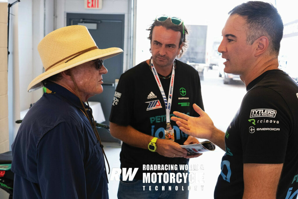 Editor John Ulrich (left) talking to Energica's Giampiero (center) and Stefano Benatti (right). Photo by Valerio Piccini.