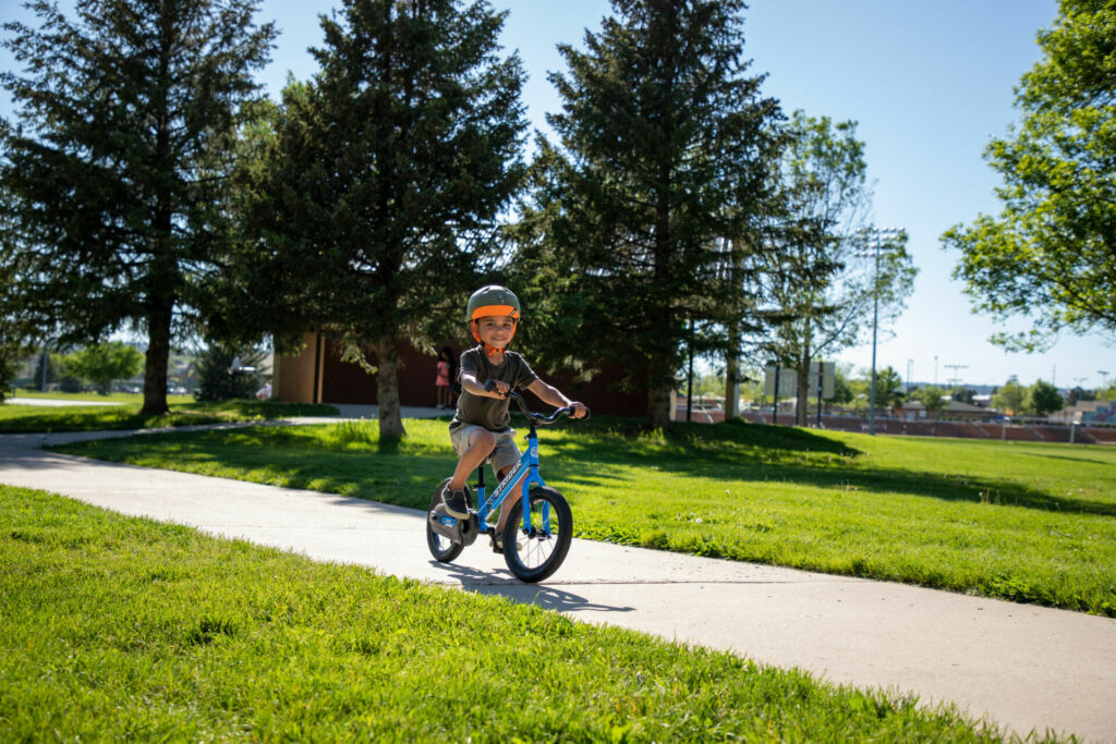 A young rider pedaling their Strider 14X Sport. Photo courtesy Strider.