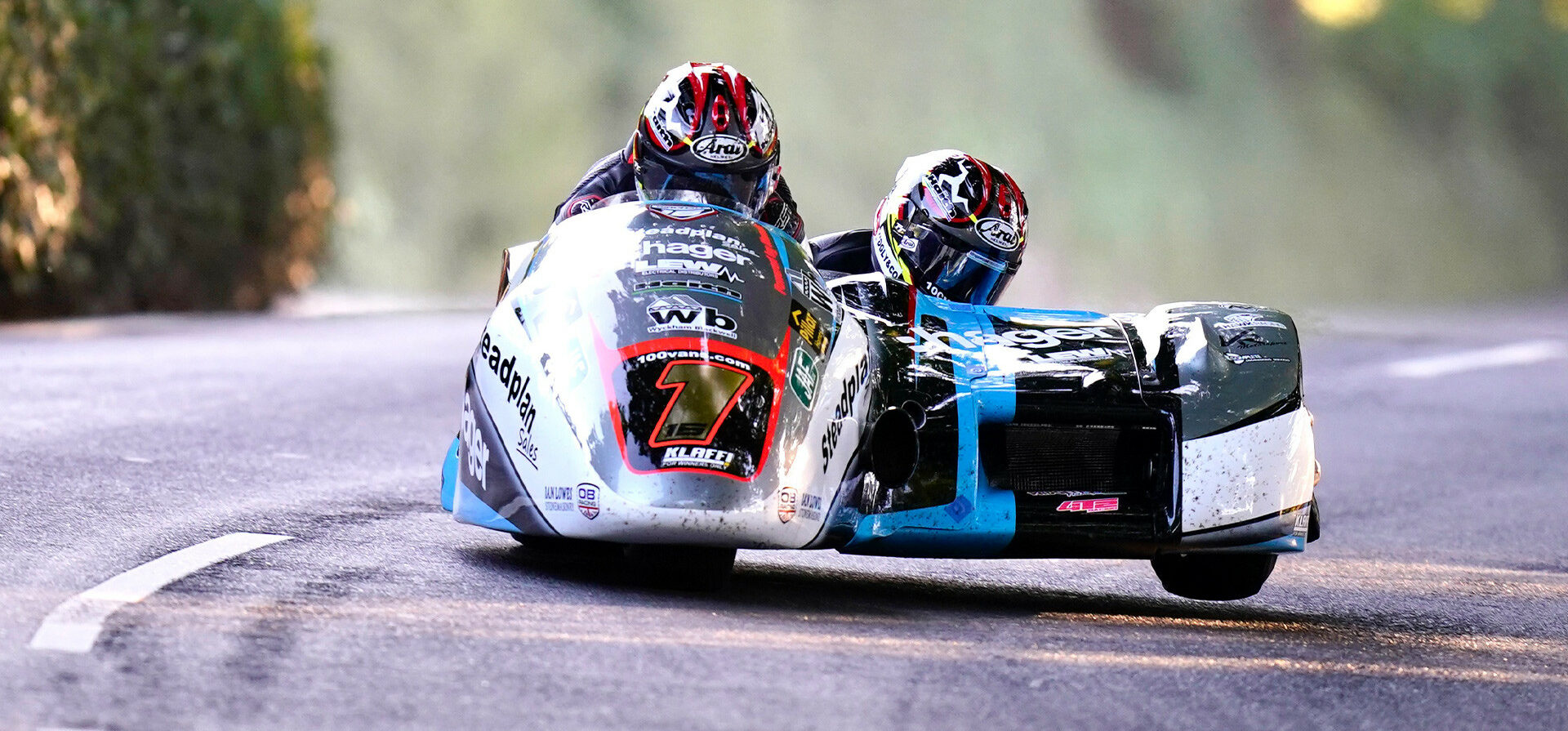 Isle of Man TT race winning sidecar passenger Tom Birchall (right) is retiring. Photo courtesy Isle of Man TT Press Office.