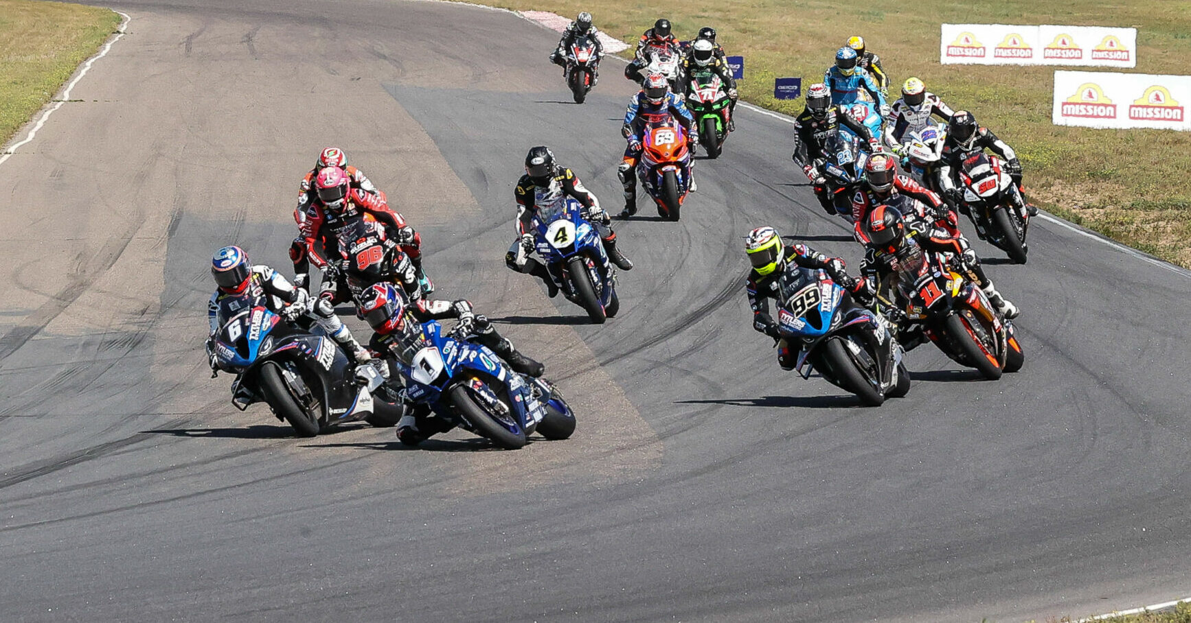 Jake Gagne (1) leads the start of MotoAmerica Superbike Race One at Brainerd, before it all went bad for Cameron Beaubier (6) and Mathew Scholtz (11). Photo by Brian J. Nelson.