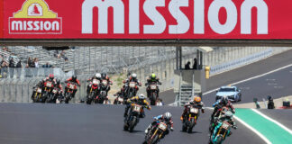 Jeremy McWilliams (99) and Stefano Mesa (137) lead the Mission Super Hooligan National Championship Race Two start over Turn One at Laguna Seca. Photo by Brian J. Nelson.