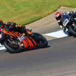AHRMA racers Steve Metz (13W) and Gus Rodio (296) at the Barber Vintage Festival. Photo by etechphoto.com, courtesy AHRMA.