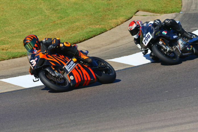 AHRMA racers Steve Metz (13W) and Gus Rodio (296) at the Barber Vintage Festival. Photo by etechphoto.com, courtesy AHRMA.
