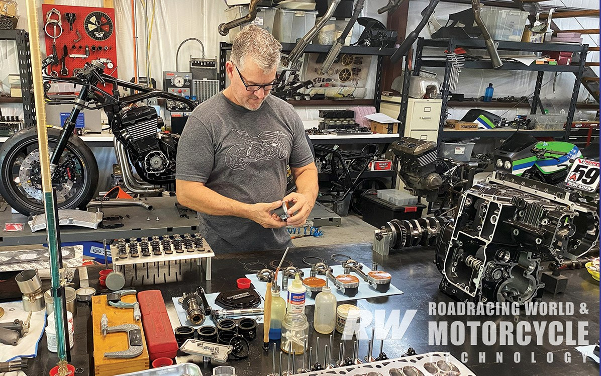 James Compton assembles a big-bore Kawasaki engine for one of his customers. Customer bikes in various stages of build can be seen in the background along with shop equipment, like the injector cleaner/flow tool over Compton’s right shoulder. Photos by David Swarts.