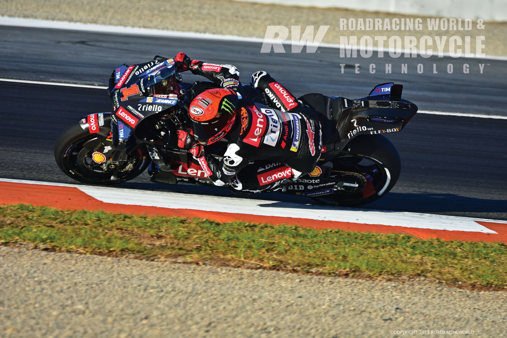 Two-time MotoGP World Champion Francesco Bagnaia tests the latest version of the title-winning Ducati Desmosedici's front aerodynamics at Valencia, including a substantial bi-wing-with-fences array on the front fairing, fork-mounted wings, and additional aerodynamic devices on each side of the fairing. Photo by Michael Gougis.