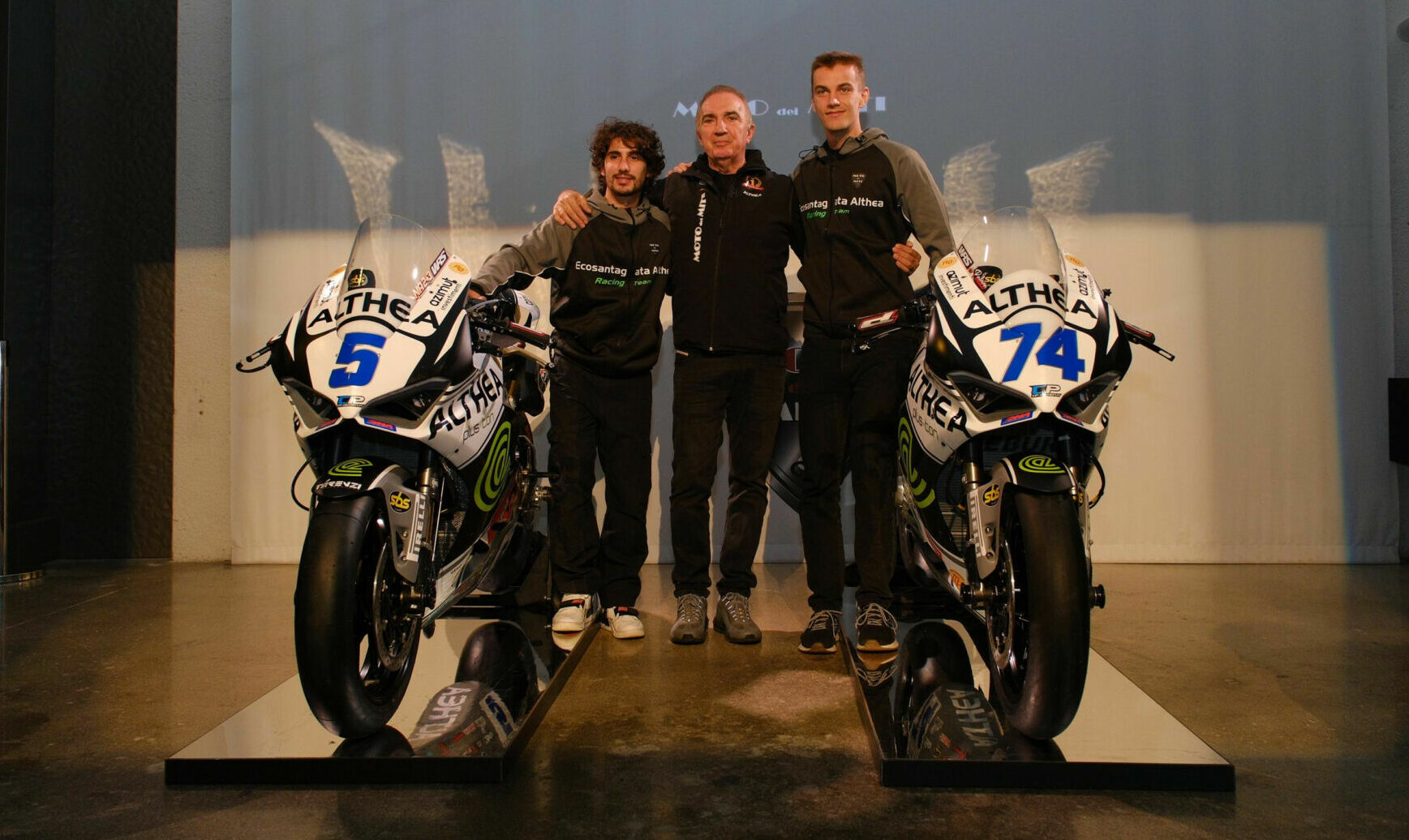 Riders Niccolò Antonelli (left) and Piotr Biesiekirski (right) with Althea Racing General Manager Genesio Bevilacqua (center). Photo courtesy Althea Racing.