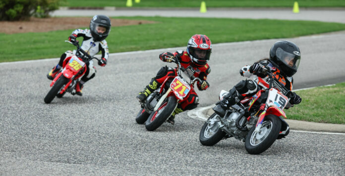 Grober Reyes (19) leads Weston Fager (71) and Cruise Texter (26) during a MotoAmerica Mini Cup Stock 50 race at Barber Motorsports Park in 2023. Photo by Brian J. Nelson.Grober Reyes (19) leads Weston Fager (71) and Cruise Texter (26) during a MotoAmerica Mini Cup Stock 50 race at Barber Motorsports Park in 2023. Photo by Brian J. Nelson.