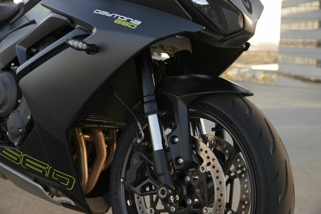 The Triumph Daytona 660 comes with non-adjustable Showa SFF-BP front forks and radial-mount four piston front brake calipers. Photo courtesy Triumph Motorcycles.