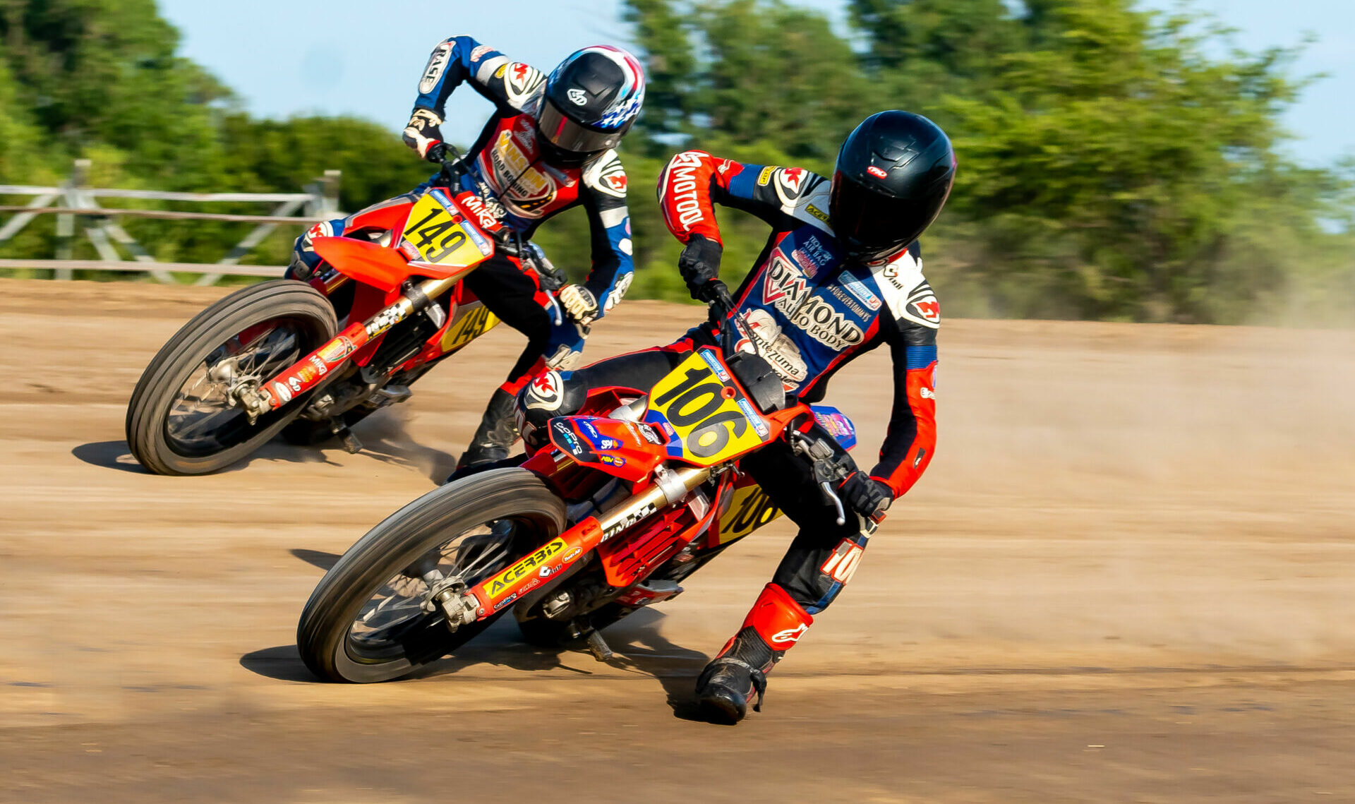 Reece Pottorf (106) and Treygan Birdsong (149) in action during a flat track race at Osborne Speedway, in Osborne, Kansas, in 2023. Photo by James Briary, courtesy XFT/NFT.