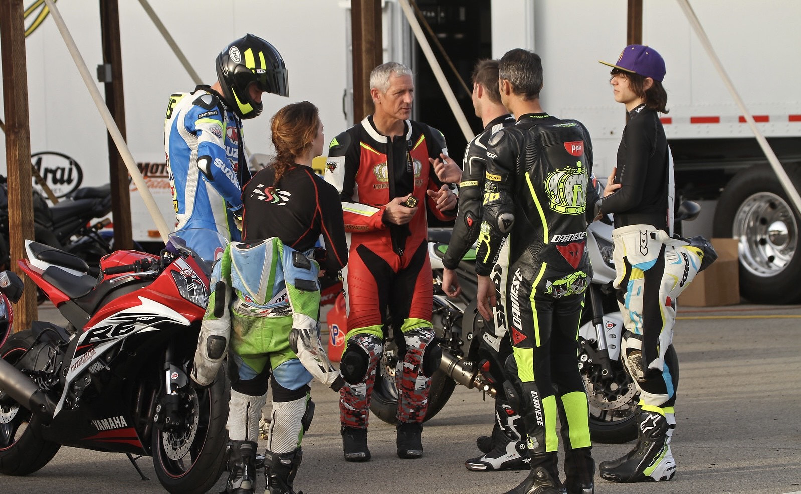 Ken Hill (in red leathers) with students and fellow riding instructors. Photo by Joe Salas, 4theRiders.com, courtesy 2Fast Motorcycle Trackdays.
