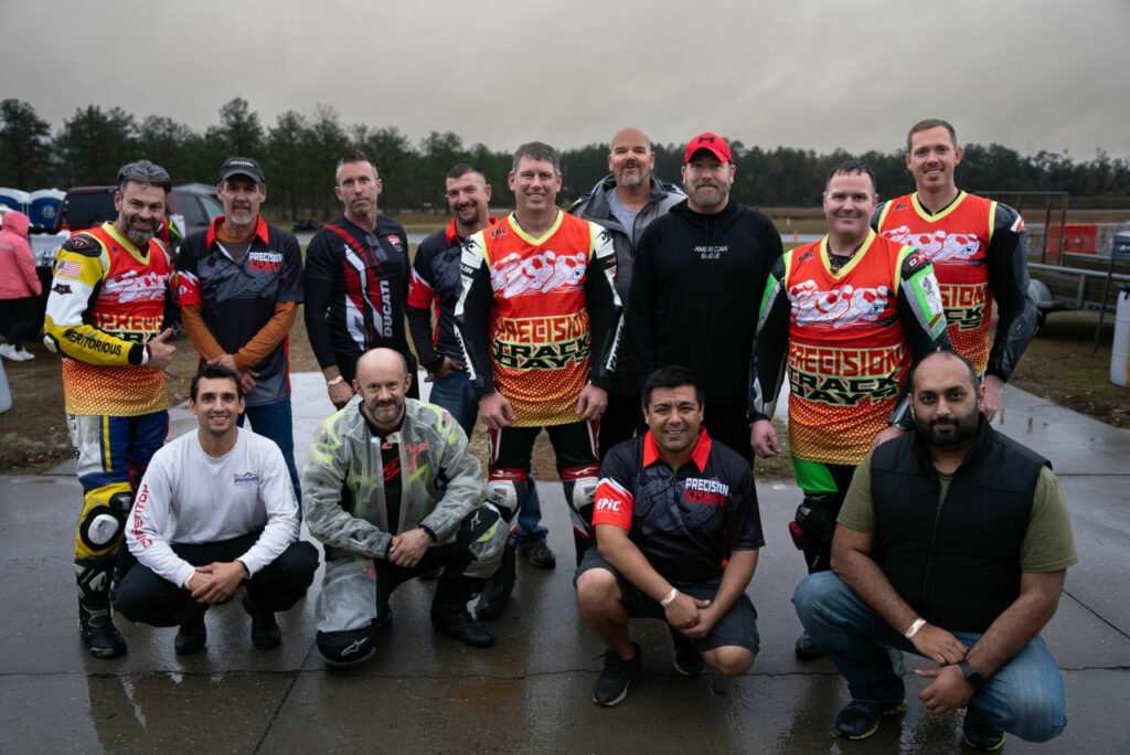 Precision Track Days staff and instructors (standing from left) Julian Lopez, Robert Dooley, Seth Starnes, Jonathan Miglionco, Jeremy Jarman, Bryan Persall, Kris Steward, Michell Edwards, and Matt Cogdel(and sitting from left) Michael Henao (special guest instructor), George Balan, Rafael Pacheco, and Fahad Khan. Photo courtesy Precision Track Days.