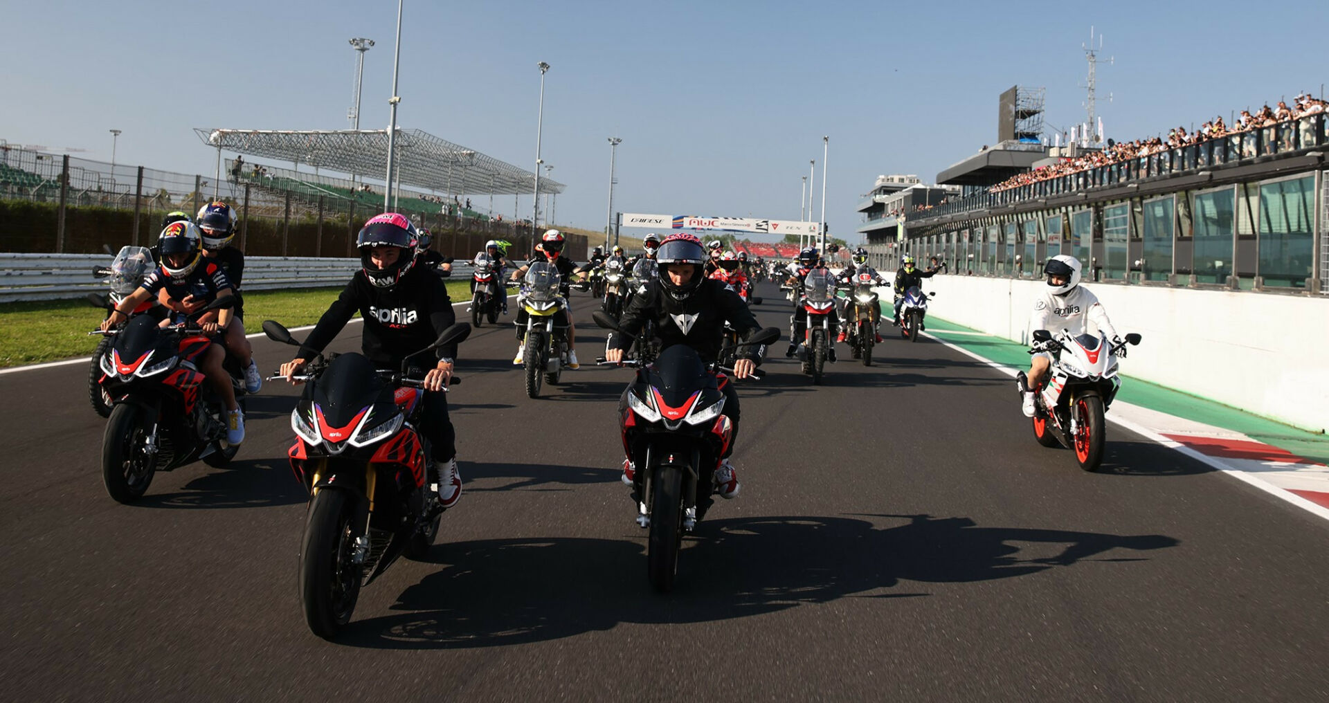 Aleix Espargaro leads a fan parade lap at the 2023 Aprilia All Stars event at Misano. Photo courtesy Aprilia.