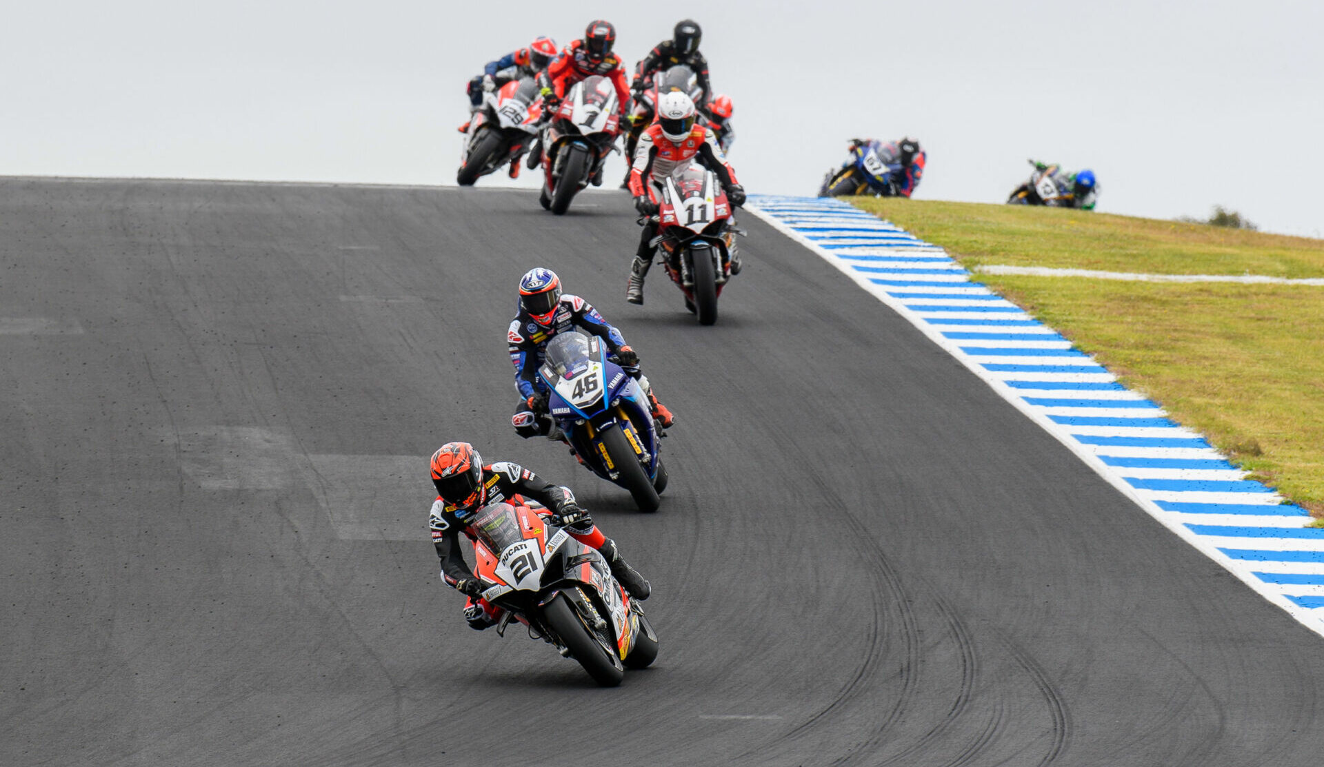 Josh Waters (21) leads Australian Superbike Race One ahead of Mike Jones (46), Broc Pearson (11), and Troy Herfoss (1). Photo by RbMotoLens, courtesy ASBK.
