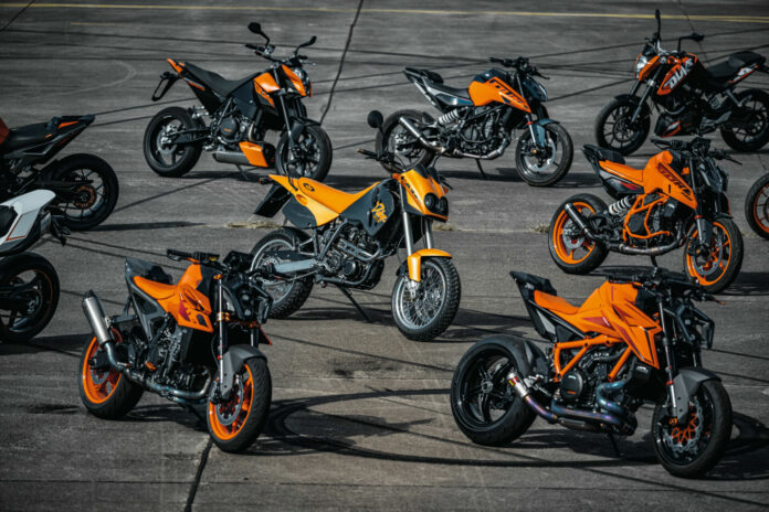 The original 1994 KTM Duke (center) with other KTM Duke models from throughout the years, including a 2024 KTM 990 Duke (bottom left) and a 2024 KTM 1390 Super Duke R EVO (bottom right). Photo by Rudi Schedl, courtesy KTM.