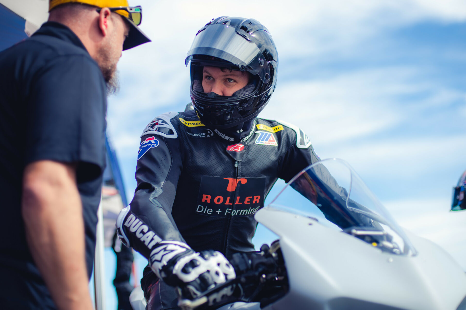 Corey Alexander talks with a crew member during the Rahal Ducati Moto test at Jennings GP, in Florida. Photo courtesy Rahal Ducati Moto.