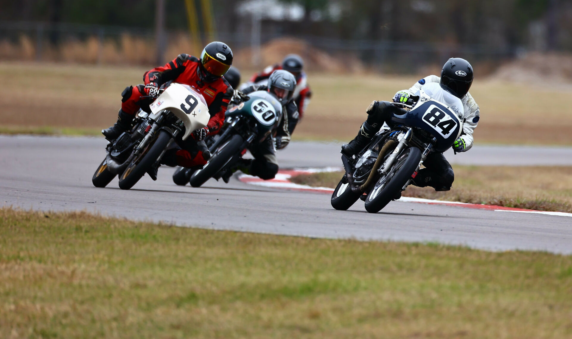 Jeff Hargis (84) leads Tony Read (50) and Mark Morrow (9X) during a Formula 750 race at Roebling Road Raceway. Photo by etechphoto.com, courtesy AHRMA.