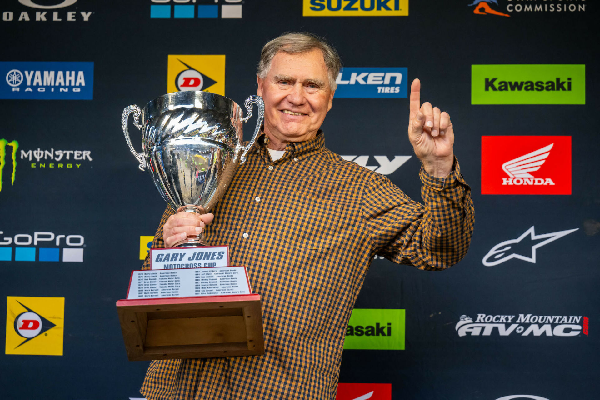 Three-time Pro Motocross 250cc Champion and AMA Hall of Famer Gary Jones with the Gary Jones Trophy. Photo courtesy MX Sports Pro Racing.