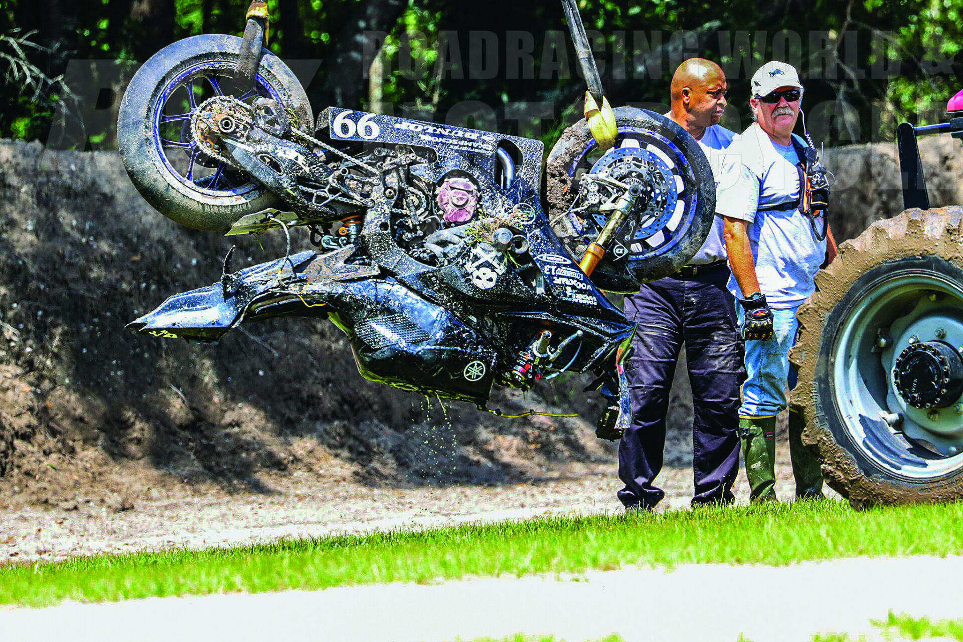 Track workers remove the AOD Yamaha after it submerged at full speed into a mud pit at Roebling Road.