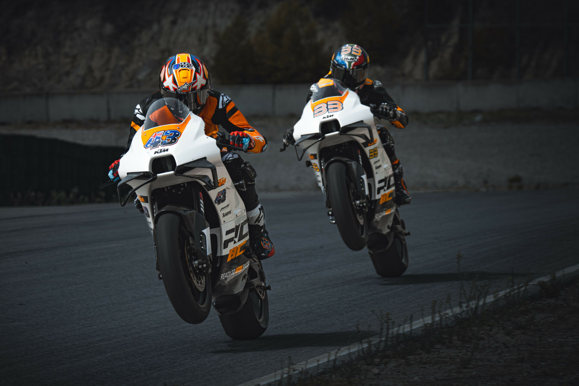 Jack Miller (43) and Brad Binder (33) at speed on KTM RC 8C track bikes. Photo E. Tschann, courtesy KTM.