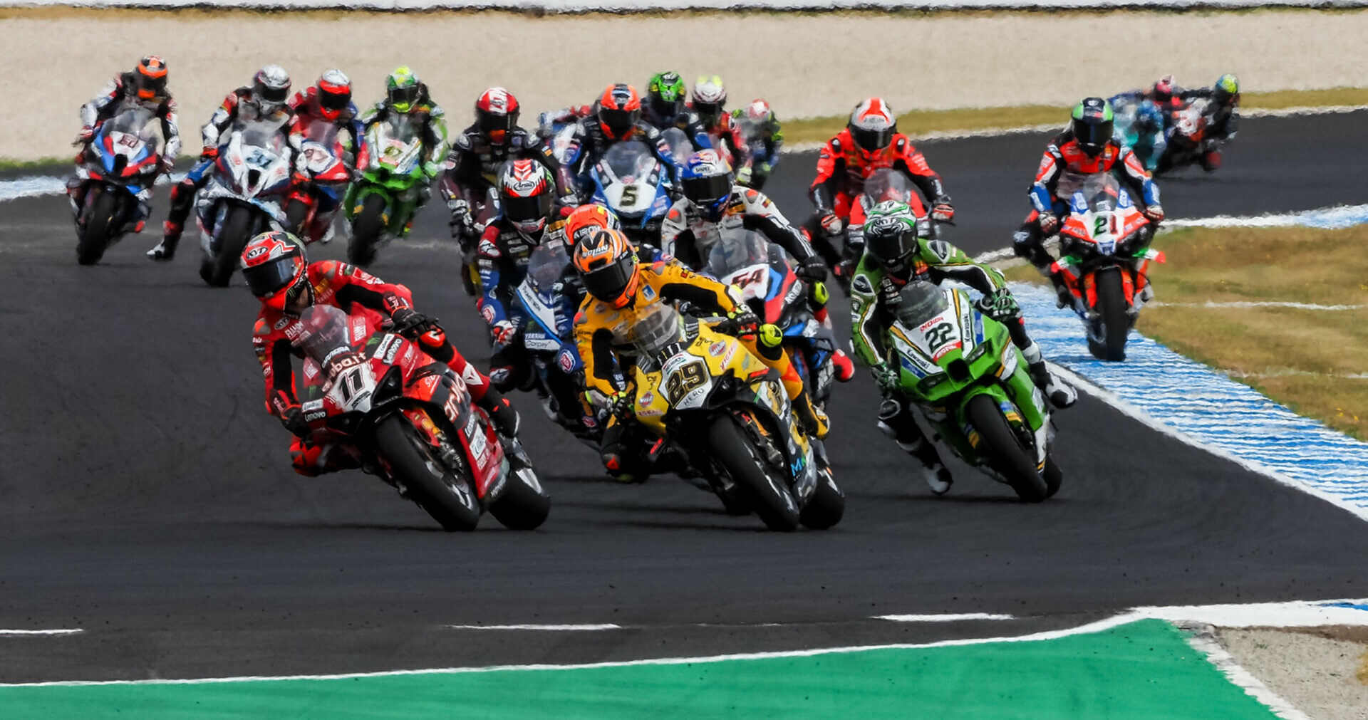 Nicolo Bulega (11) and Andrea Iannone (29) battle for the lead at the start of a WorldSBK race at Phillip Island. Photo courtesy Dorna.