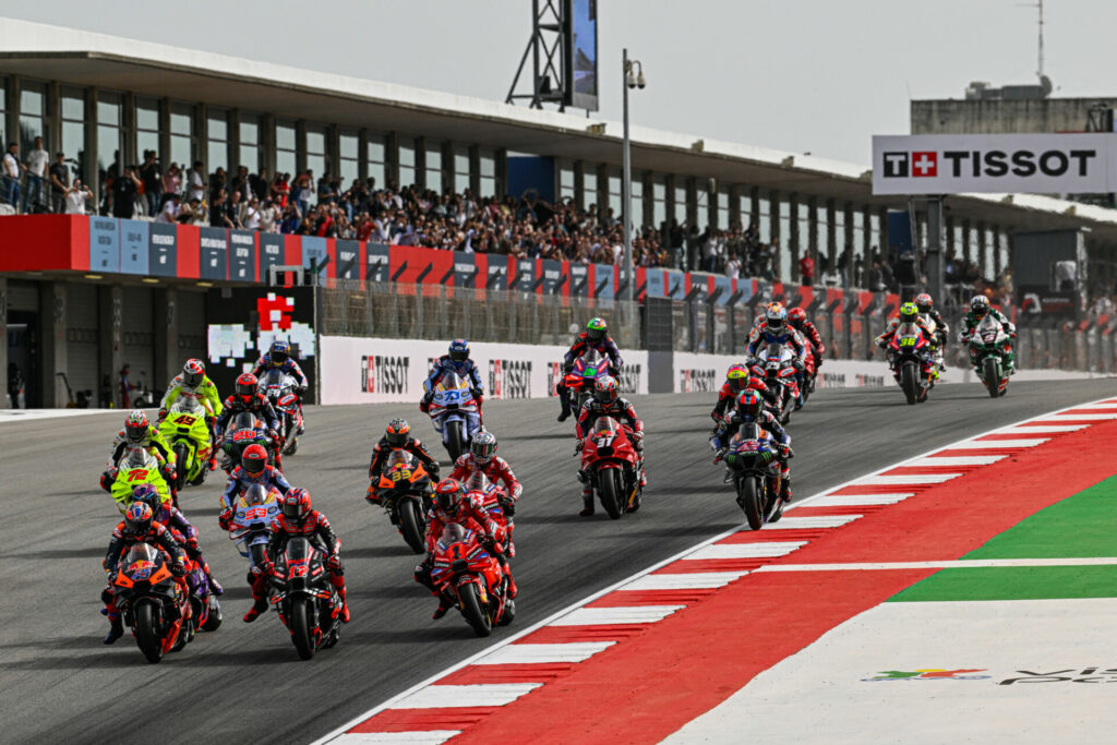 Jack Miller (43), Maverick Vinales (12), and Francesco Bagnaia (1) fight for the lead into Turn One at the start of Saturday's MotoGP Sprint Race in Portugal. Photo courtesy Dorna.