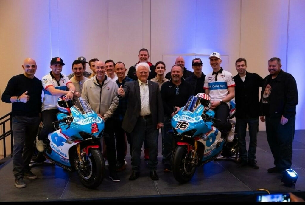 The 2024 OnlyFans Warhorse Ducati team with Josh Herrin (left) and Loris Baz (right) seated on their bikes and Elrado Ferracci (center). 
